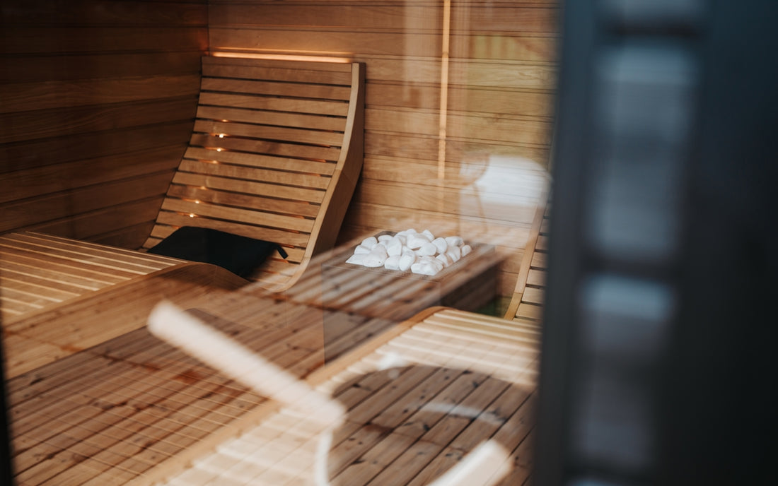Interior of a modern wooden sauna with heated stones.