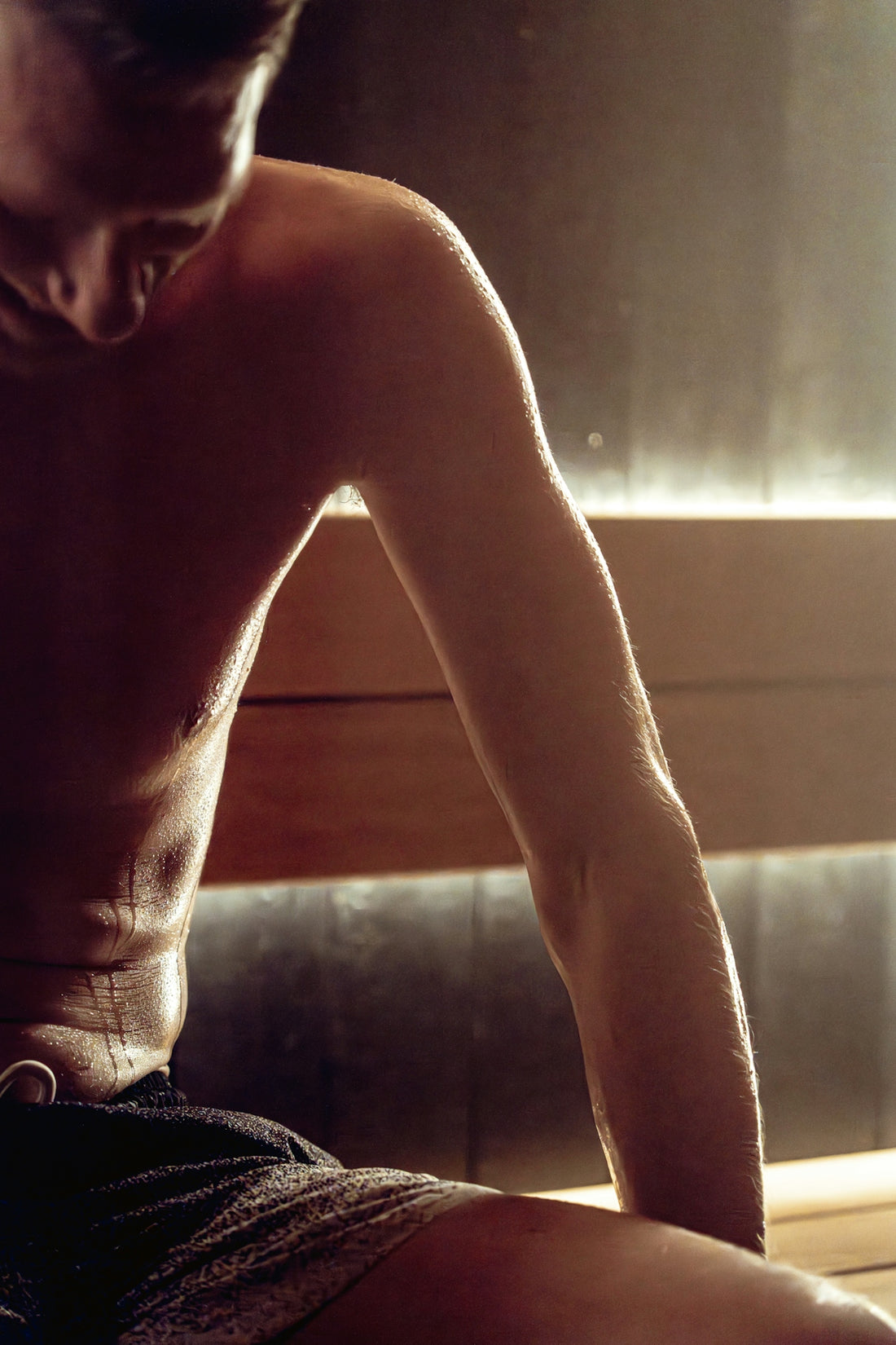 Man sweating in a steamy sauna