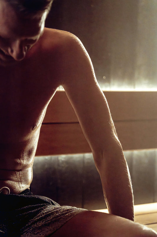 Man sweating in a steamy sauna